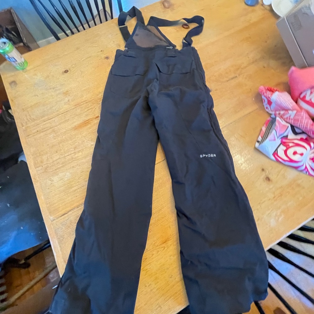 Zip off ski pants with shoulder straps. Great condition. Spyder size 14